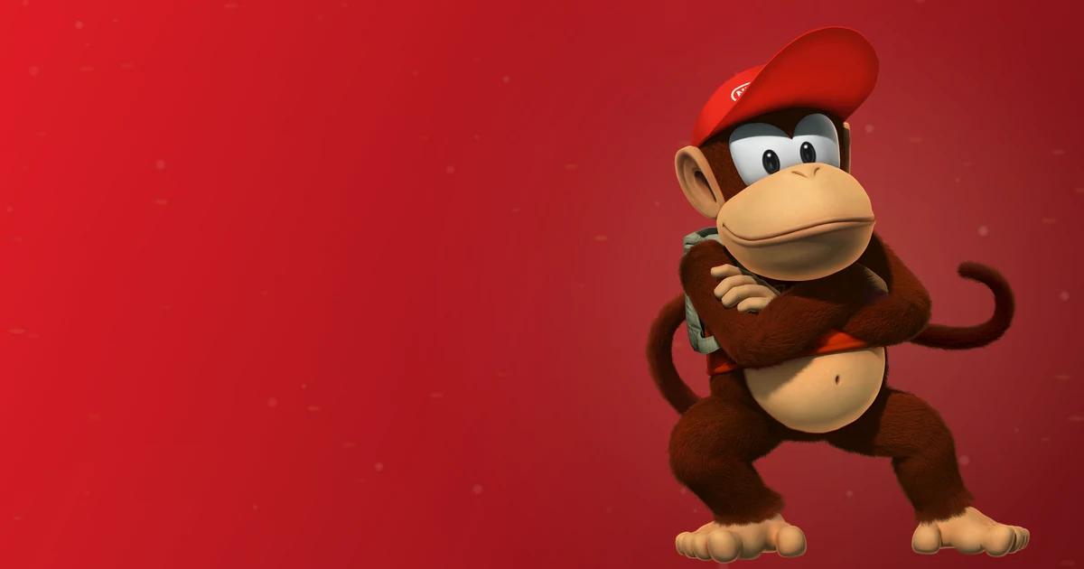 Diddy Kong, compañero de Donkey Kong, con su clásica gorra roja con estrella y brazos cruzados sobre fondo rojo Nintendo
