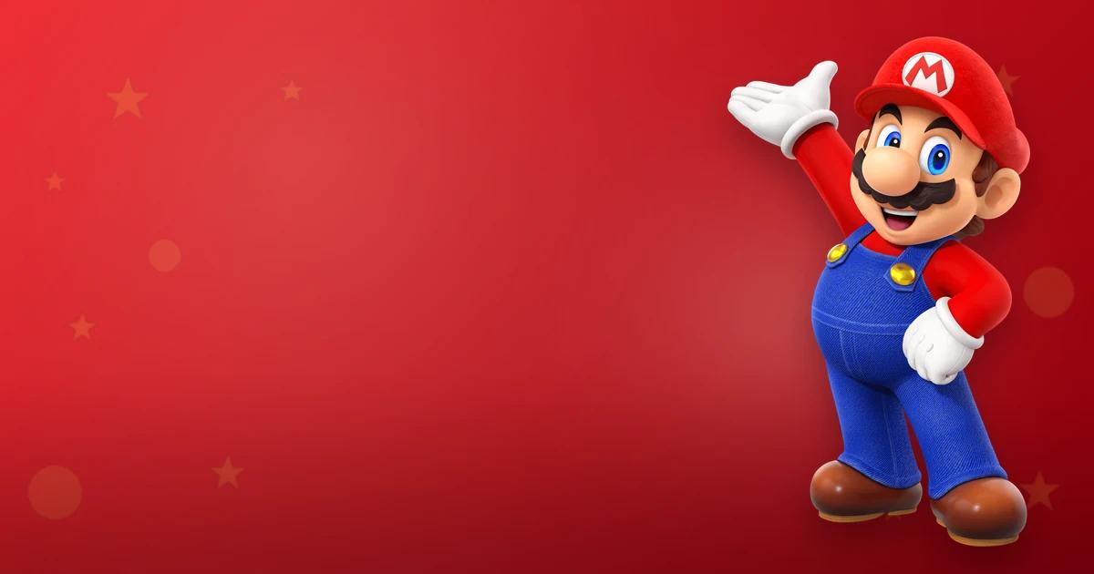 Mario Bros, icónico fontanero de Nintendo, saluda en pose clásica con gorra roja y peto azul sobre fondo rojo